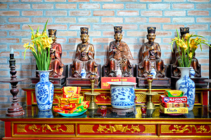 Hanoi altar with statues and offerings during local festival by Marco Brivio