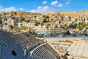 View of Roman Theater in Amman Jordan with surrounding buildings