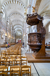 Visitors explore the interior of Vezelay Abbey in Bourgogne Fra