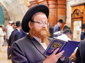 Orthodox Jews engaged in prayer at the Wailing Wall in Jerusalem