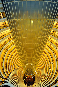 Shanghai grand hotel atrium has curved balconies and glass ceili