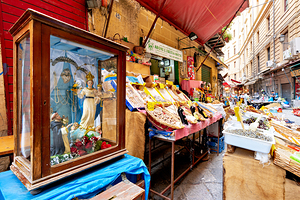 Exploring Vucciria Market in Palermo Sicily on a sunny day