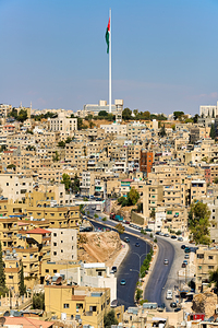 City view of Amman Jordan with buildings and tall flagpole
