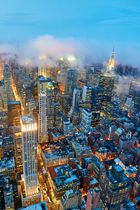 Dusk view of Manhattan showing city lights and skyscrapers