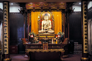 Buddha statue in ornate temple in Shanghai China