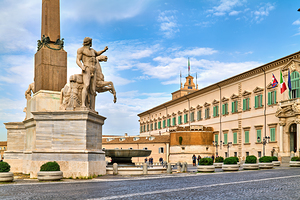 Quirinal Palace in Rome on a clear day with historic sculptures