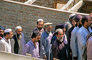 Men heading to work in Peshawar streets during morning hours