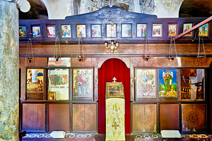 Old church interior with icons and altar in quiet setting