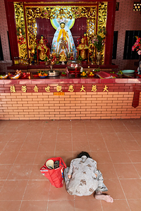 Worship at a temple in Ho Chi Minh City Vietnam by Marco Brivio