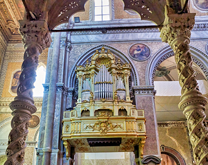 Golden organ in Naples Cathedral with detailed architecture