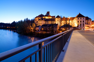 View of St. Mang Abbey at dusk along the Lech River in Bavaria