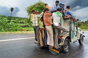 Many people travel on a loaded vehicle in Rajasthan India