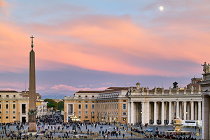 Saint Peters Square at dusk with people and sky colors