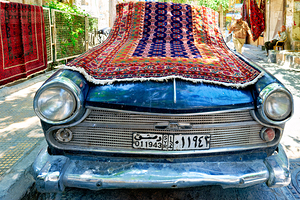 Car covered with carpets on a street in Damascus Syria