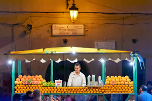 Orange juice stall in Marrakesh with fresh fruits at night
