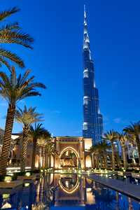 Dubai skyline with Burj Khalifa palm trees and reflections at 