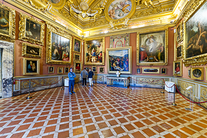 Visitors explore the Palatine Gallery inside Palazzo Pitti in Fl