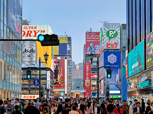 Signboards in Dotonbori District draw crowds during sunset in Os