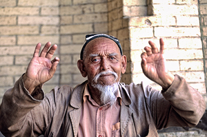 Man gestures in Khiva Uzbekistan during a sunny day