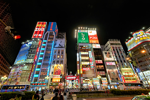 Neon lights shine bright in Shinjuku district of Tokyo at night