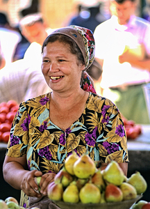 Market scene in Khiva Uzbekistan with vendor and fruits