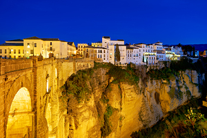 Ronda city at night near El Tajo gorge in Spain
