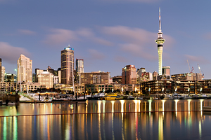 Auckland skyline with buildings and Sky Tower during evening