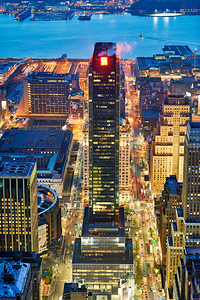 Aerial view of Manhattan at dusk showing city lights and buildin