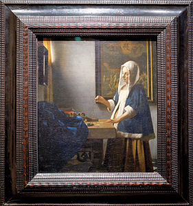 Johannes Vermeer - Woman holding a balance - 1664