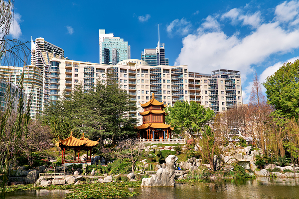 Chinese garden with pagodas and modern buildings Print