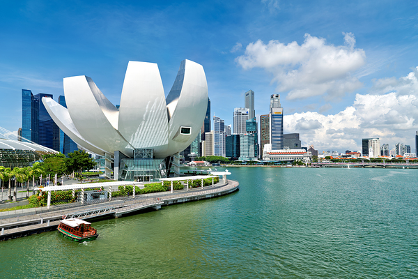Visitors view ArtScience Museum and city skyline in Singapore Print