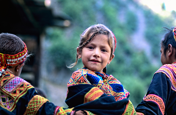 Kids enjoying life in Kalash village Bumburet Valley Print
