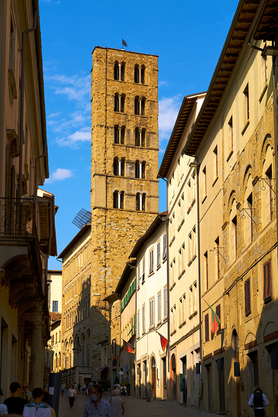 People walk along a street in Arezzo Tuscany Italy Print
