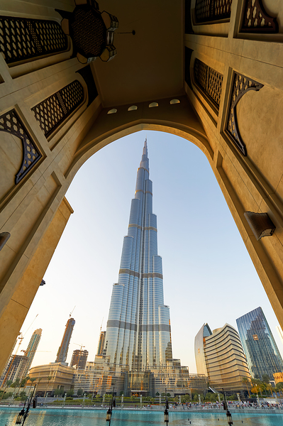 Burj Khalifa seen through ornate arch in Dubai cityscape Print