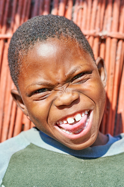 Joyful child smiles in Kavango Region of Namibia Print