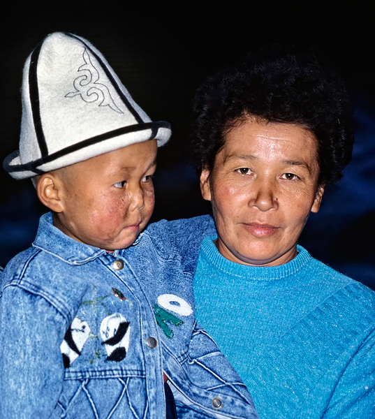 Uzbekistan mother and child in traditional attire during daytime Print