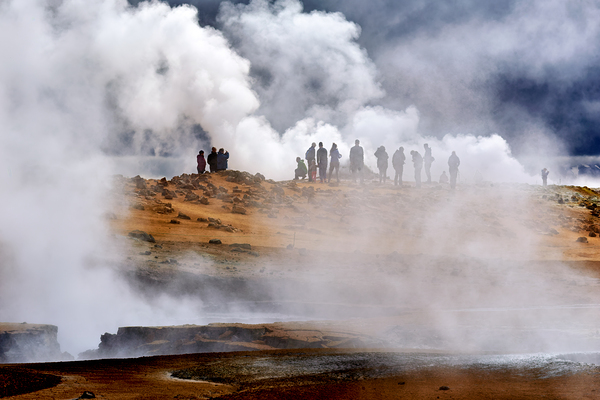 Visitors exploring the hverir hot springs in Iceland by Marco Brivio