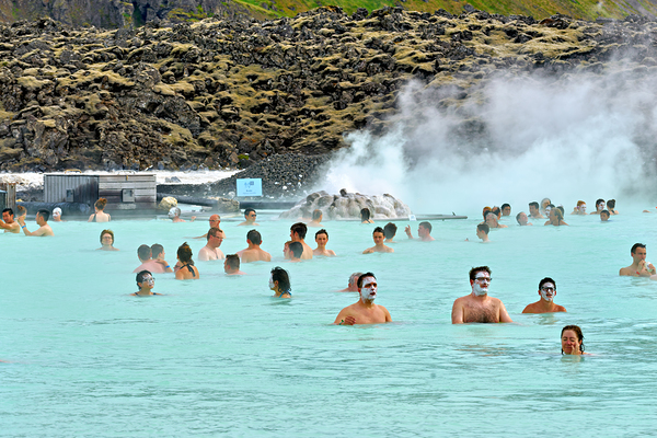 Visitors enjoy Grindaviks blue lagoon spa by day by Marco Brivio