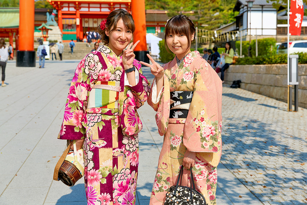 Young women enjoy Fushimi Inari Taisha Shrine in Kyoto Japan Print