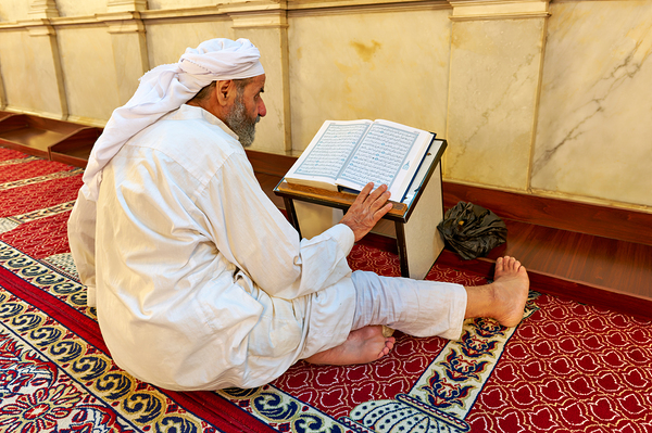Elderly man reading Quran inside Umayyad Mosque in Damascus Syri Print