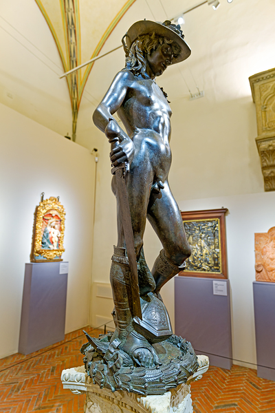 Bronze David stands in Museo Nazionale del Bargello in Florence Print