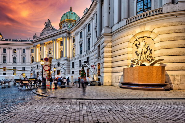 Hofburg Palace Vienna illuminated at dusk with festive street  Print