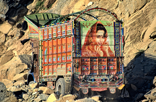 Trucks carrying goods to Shandur Pass in Pakistan Print