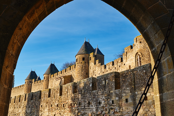 Exploring the historic walls of Carcassonne in France under blue Print