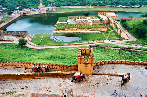 Exploring Amber Palace in Rajasthan with visitors and elephants Print