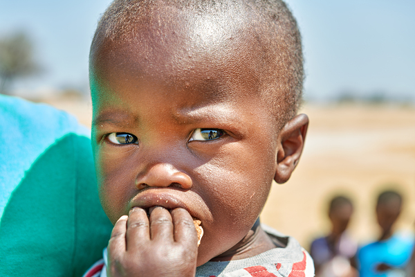 Sad boy in Kavango Region of Namibia looks thoughtful and lost Print
