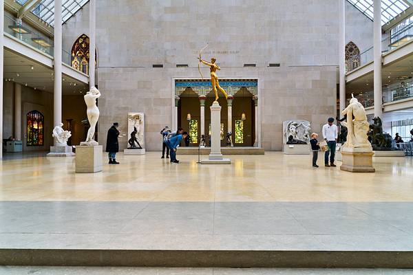 Visitors explore Engelhard Court at the Met in Manhattan Print