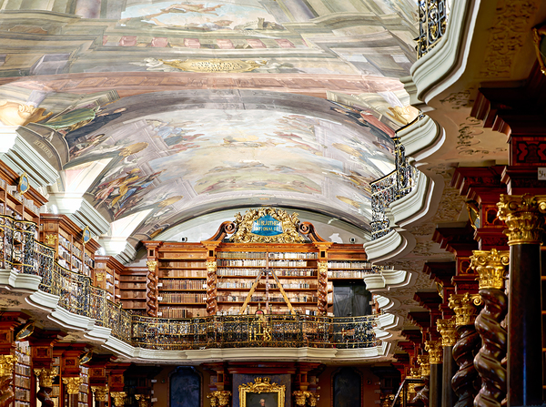 Grand baroque library with painted ceilings and countless books. by Marco Brivio