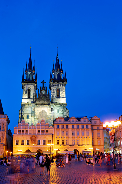Pragues Tyn Church and Old Town Square at night. by Marco Brivio