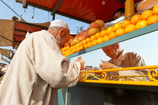 Fresh orange juice stall in Djema el Fnaa square in Marrakesh M Print
